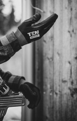 a black and white photo of a person riding a motorcycle